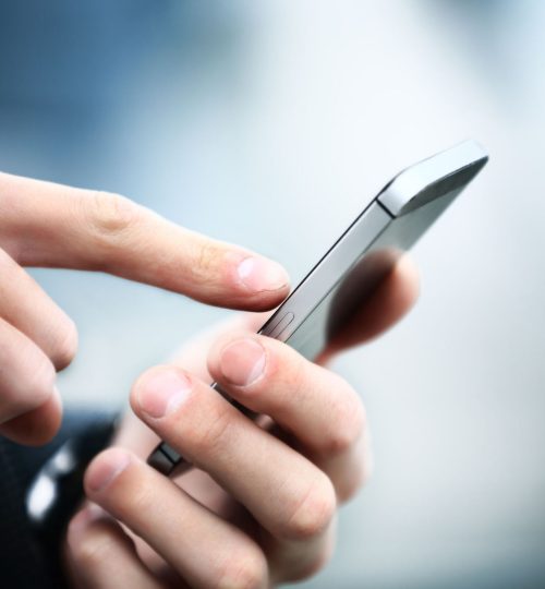 34198353 - close up of a man using mobile smart phone