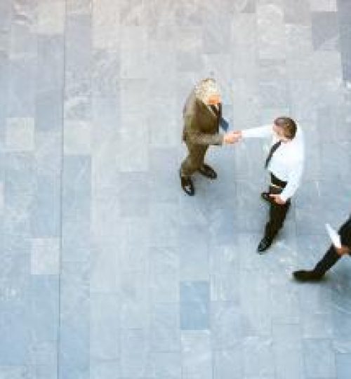 office-worker-handshake-aerial